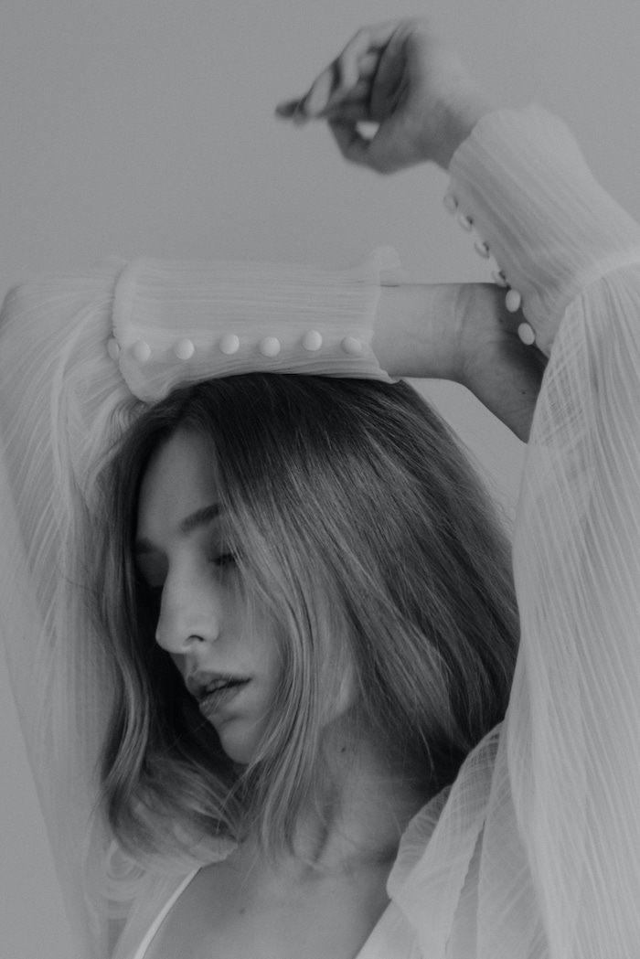 Bride in wedding dress during editorial photoshoot at Kelowna bridal boutique Candè Bridal Boutique by Jordana Dickson